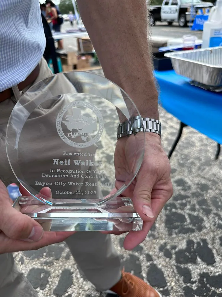 Hand-held crystal award presented to Neil Walker in October 2023 for community service in Katy and west Houston